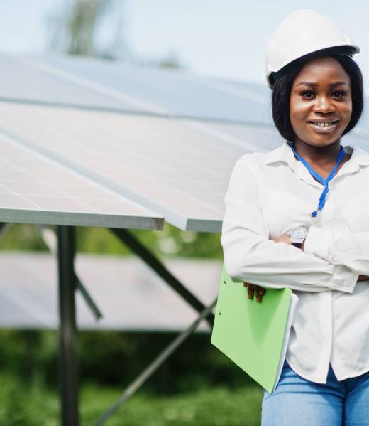 African american technician check the maintenance of the solar panels. Black woman engineer at solar station.